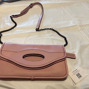 Coach Pink Crossbody Bag with Flap Closure and Chain Strap